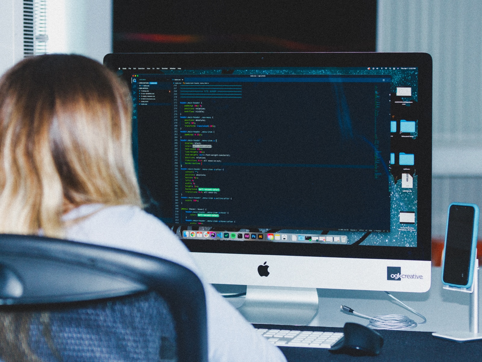 web developer coding responsive website using html and css
